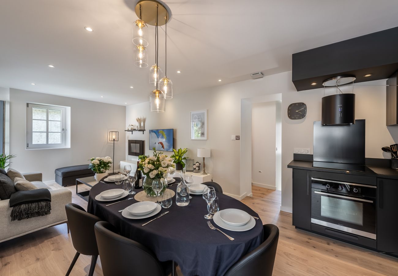 Spacious dining room with open kitchen overlooking the living room