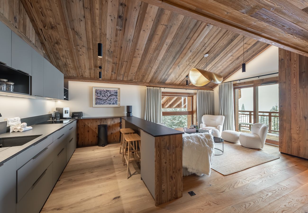 Luxurious Open Kitchen in the Heart of Méribel - Harmony between Living Room, Dining Area, and Culinary Facilities.