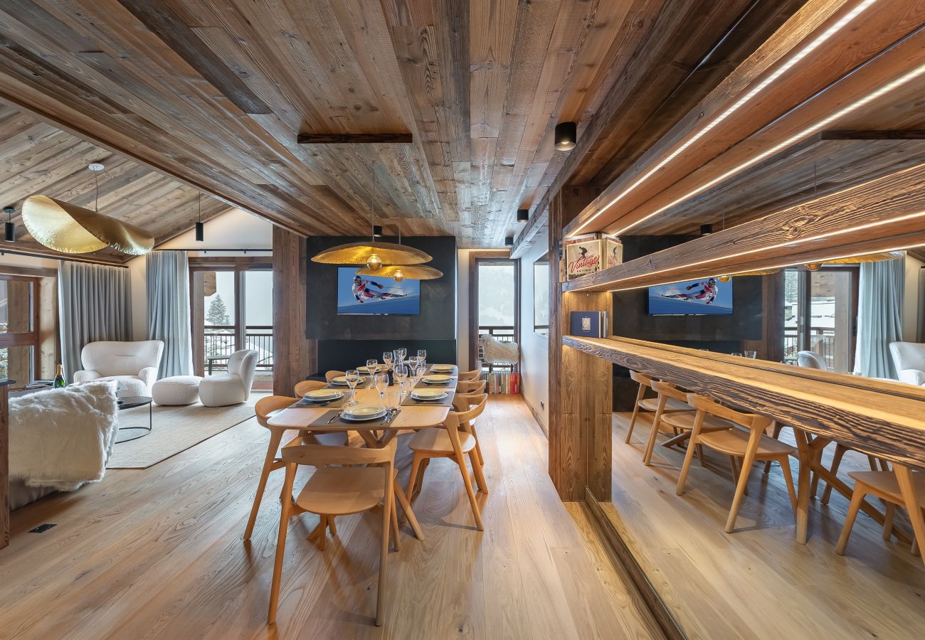 Luxurious dining room interior in our apartment in Meribel, with panoramic views of the mountains.