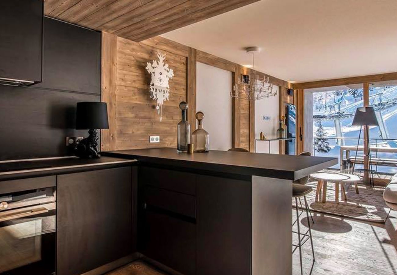 Appartement location saisonnière Courchevel pieds des pistes, airbnb luxe dans les alpes, ski in out proche du centre 