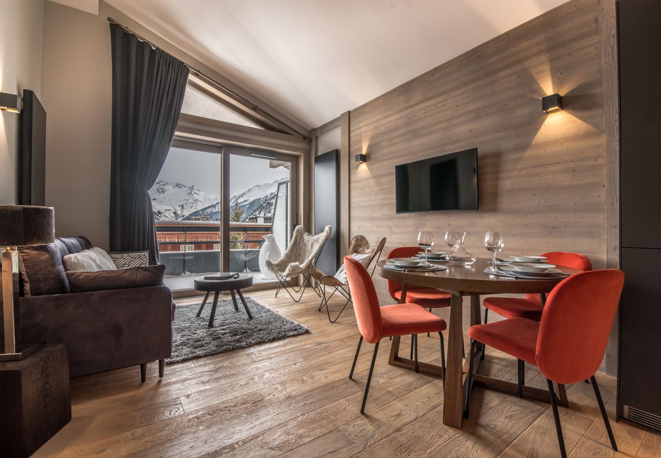 Appartement location saisonnière Courchevel pieds des pistes, airbnb luxe dans les alpes, ski in out proche du centre 
